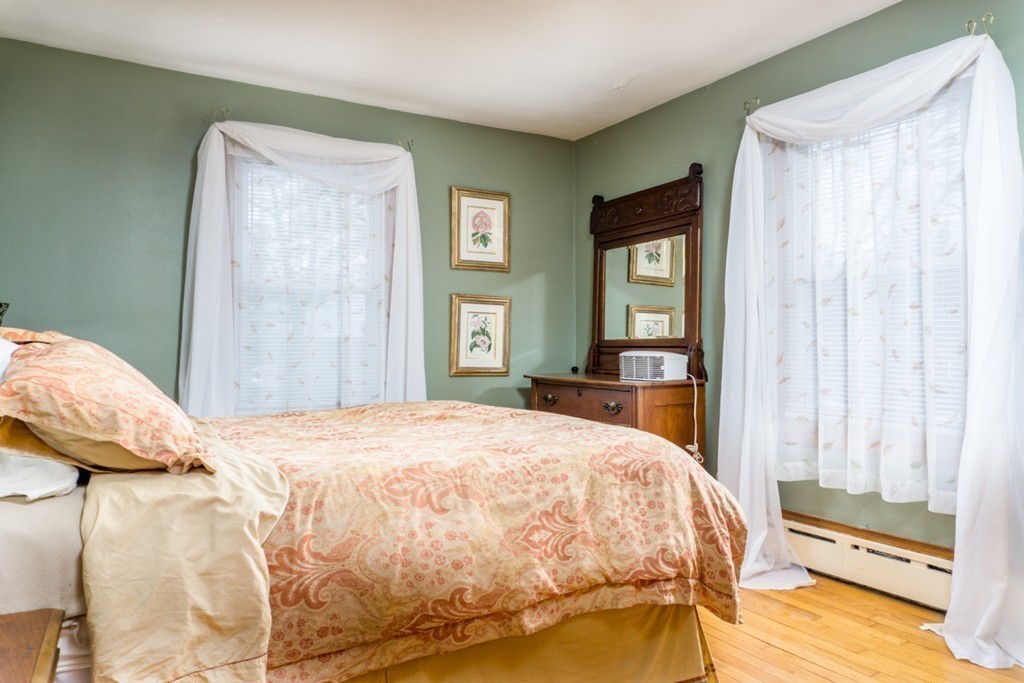 2032 Calkins Road Palmer, MA 01069 - Photo 13 of 23 a bedroom with a bed and a large mirror on the dresser