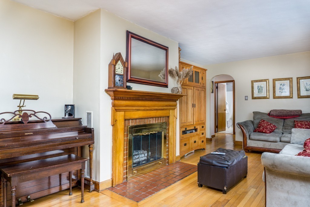 2032 Calkins Road Palmer, MA 01069 - Photo 7 of 23 a living room with furniture and a fireplace