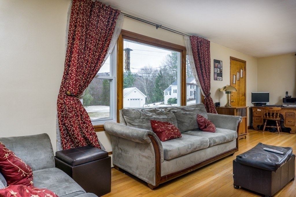 2032 Calkins Road Palmer, MA 01069 - Photo 8 of 23 a living room with furniture and a large window