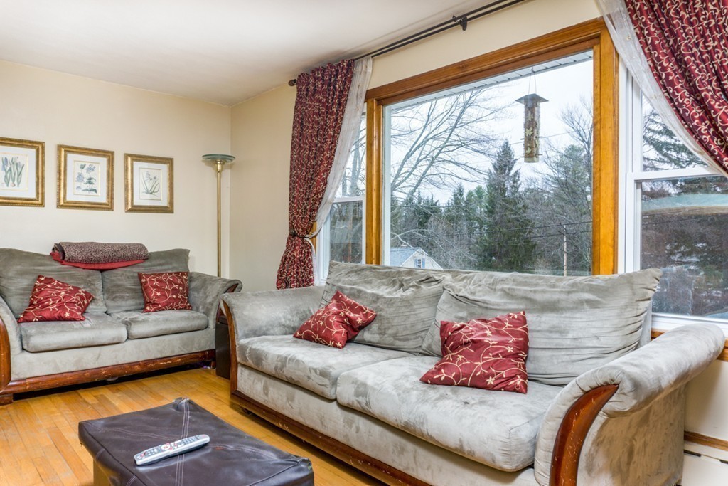 2032 Calkins Road Palmer, MA 01069 - Photo 10 of 23 a living room with furniture and a large window