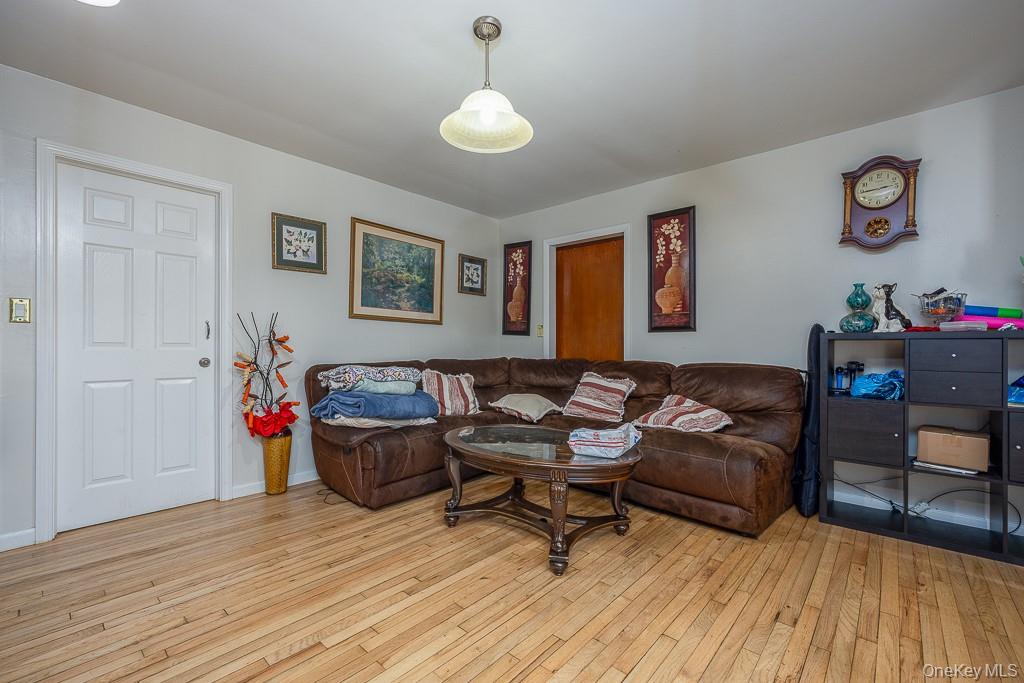 23 Sky Meadow Road Suffern, NY 10901 - Photo 11 of 36 a living room with furniture and wooden floor