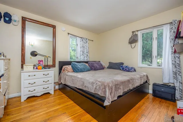 a bed room with a bed and a window