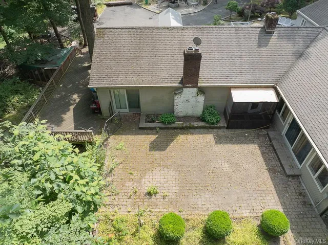 front view of a house with potted plants