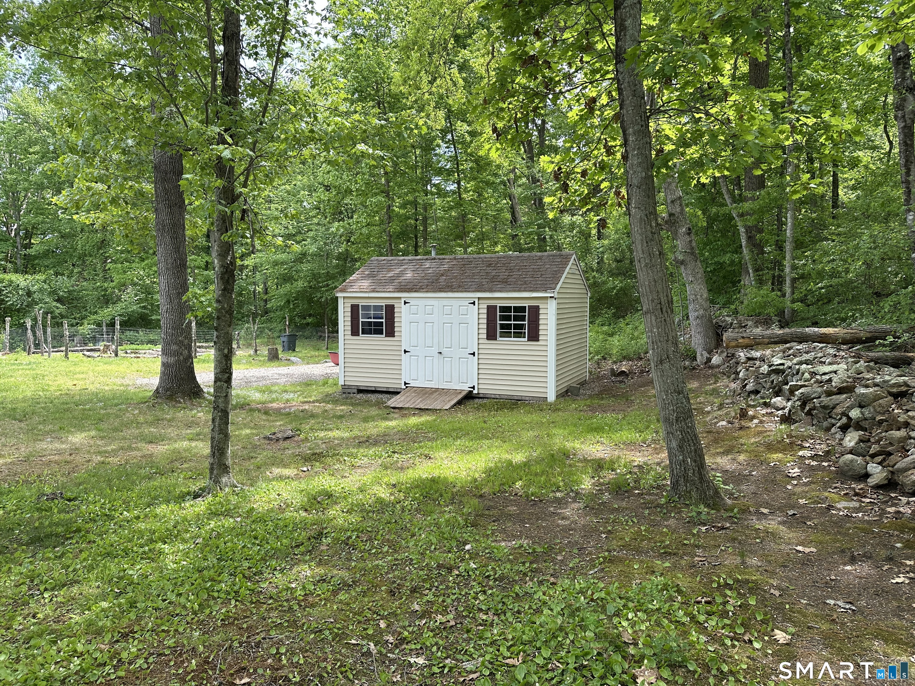 116 Tatnic Hill Road Brooklyn, CT 06234 - Photo 7 of 27 a view of a house with backyard and tree