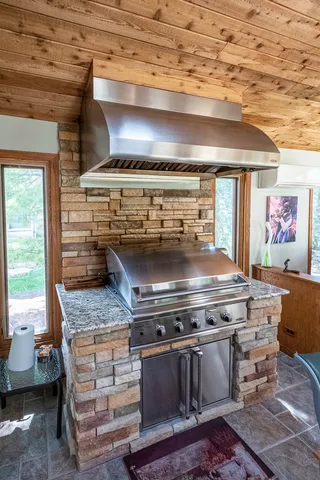 a stove top oven sitting inside of a kitchen
