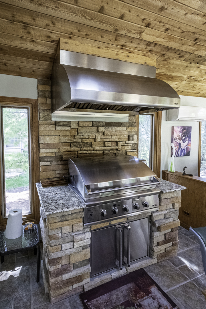 4214 Venard Road Downers Grove, IL 60515 - Photo 12 of 45 a stove top oven sitting inside of a kitchen