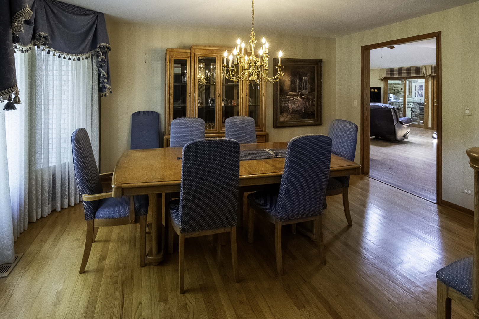 4214 Venard Road Downers Grove, IL 60515 - Photo 14 of 45 a view of a dining room with furniture and wooden floor