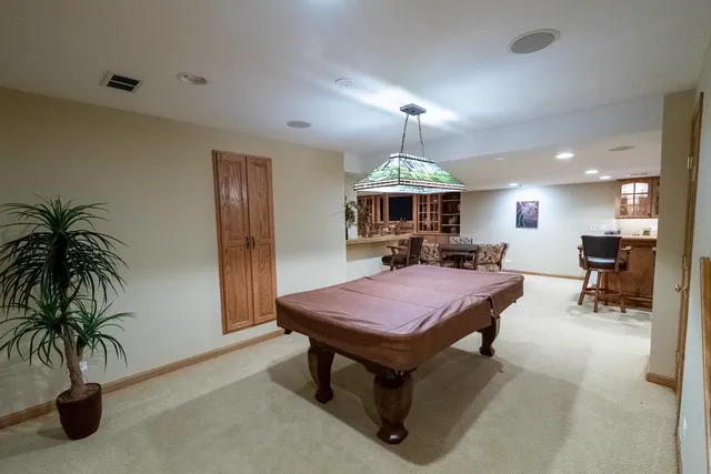 a view of a livingroom with furniture and a chandelier