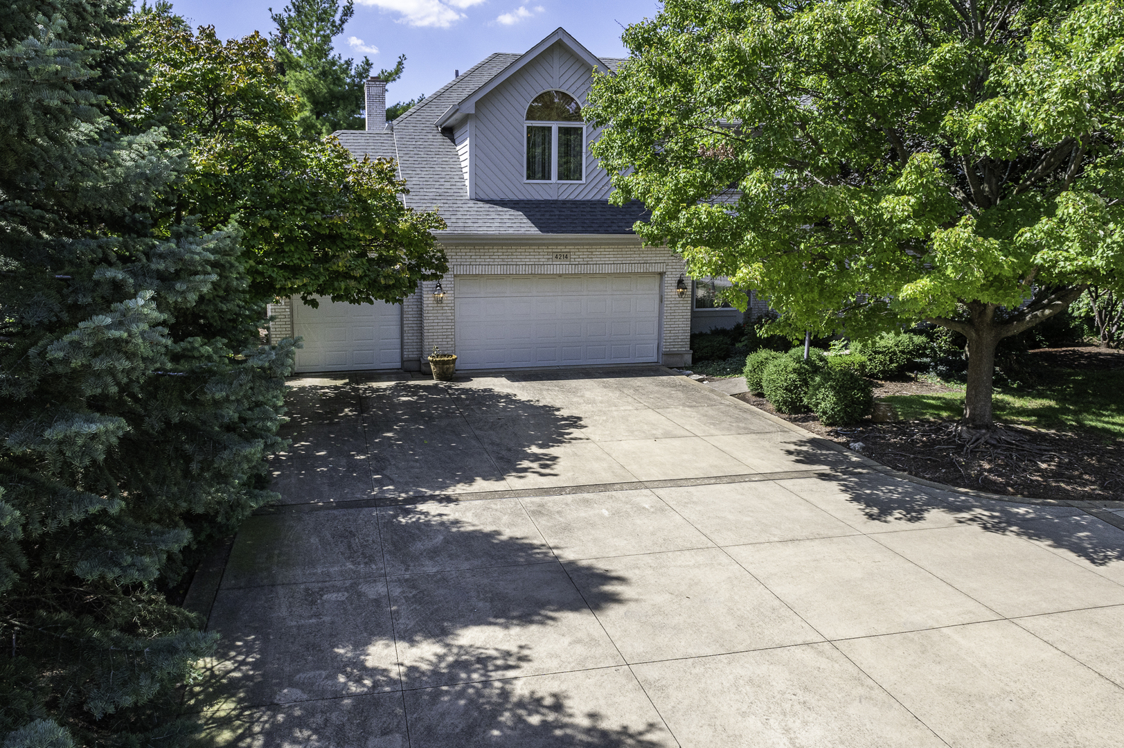 4214 Venard Road Downers Grove, IL 60515 - Photo 2 of 45 a front view of a house with a yard and garage