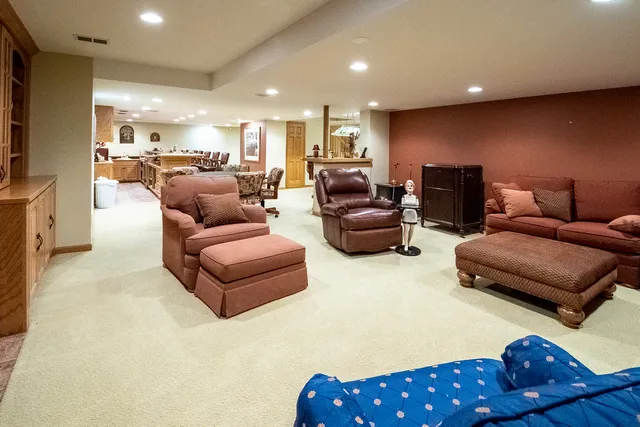 a view of a patio with table and chairs