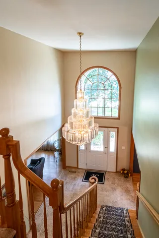 a spacious bedroom with a bed and a window
