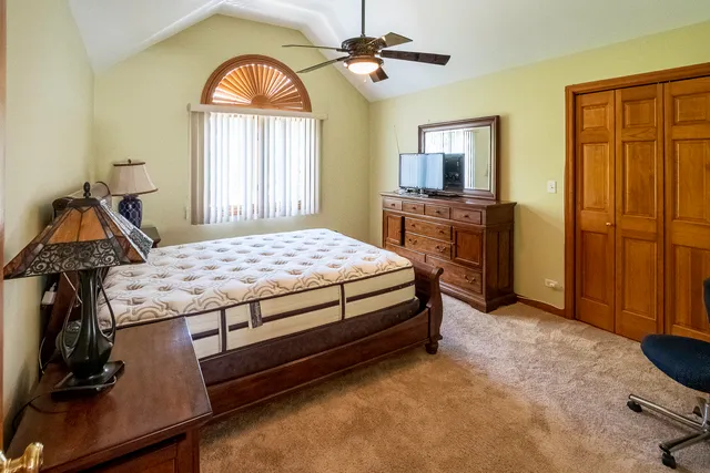 a living room with furniture a large window and a flat screen tv
