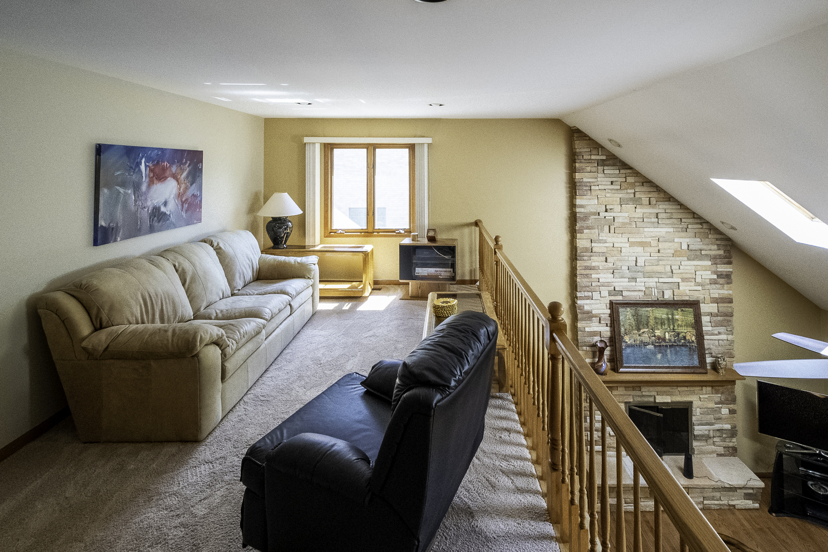 4214 Venard Road Downers Grove, IL 60515 - Photo 33 of 45 a living room with furniture a large window and a flat screen tv