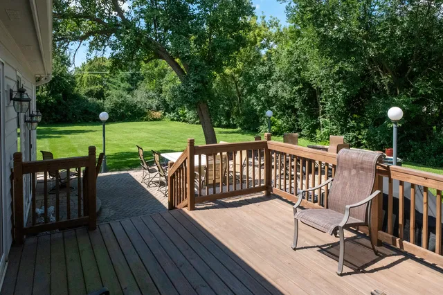 a view of a dinning table and chairs in the garden