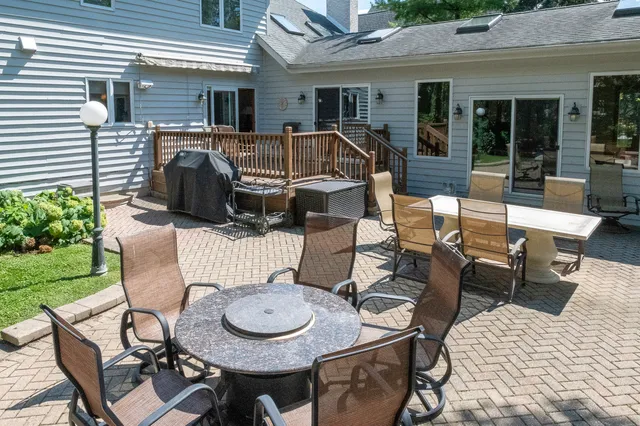 a view of a backyard with a small yard and large trees