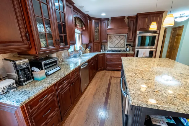 a kitchen with granite countertop lots of counter top space
