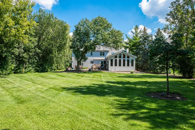 a view of a house with a yard