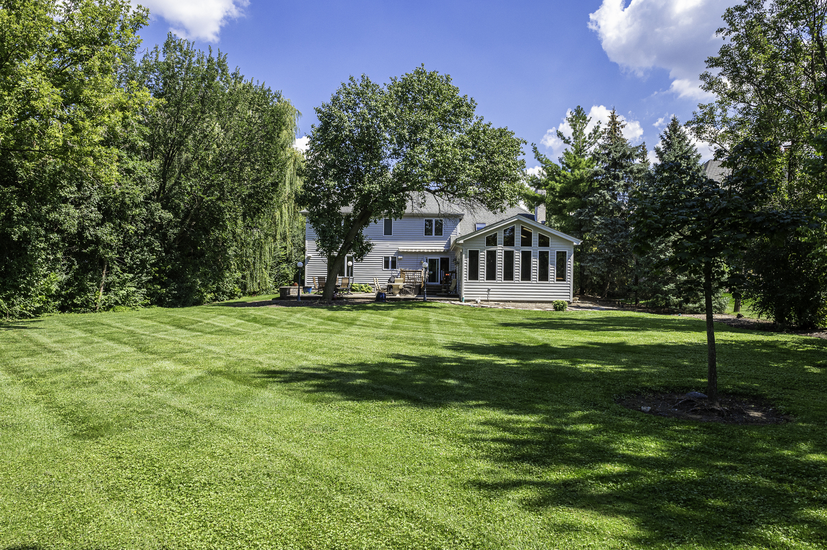 4214 Venard Road Downers Grove, IL 60515 - Photo 42 of 45 a house view with swimming pool in front of it