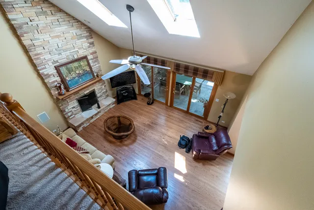 a view of living room with furniture and a fireplace