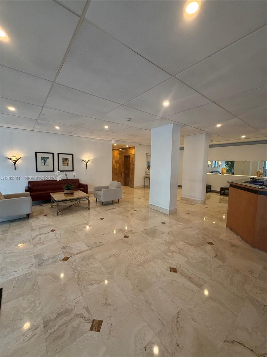 150 Southeast 25th Road, Unit 15J Miami, FL 33129 - Photo 19 of 20 24-hour lobby attendant person