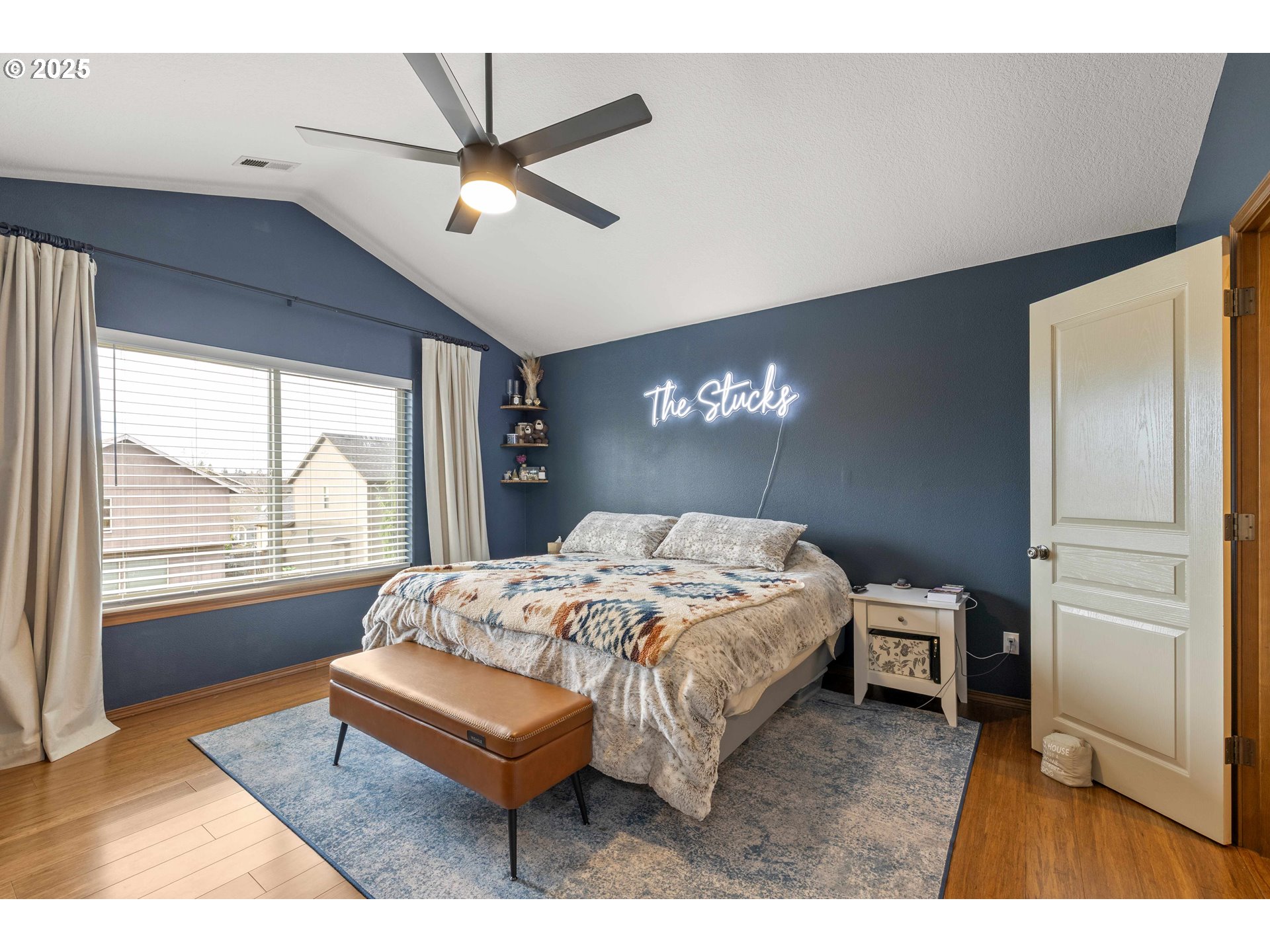 18465 Meadow Avenue Sandy, OR 97055 - Photo 19 of 43 a bedroom with a bed window and a chandelier