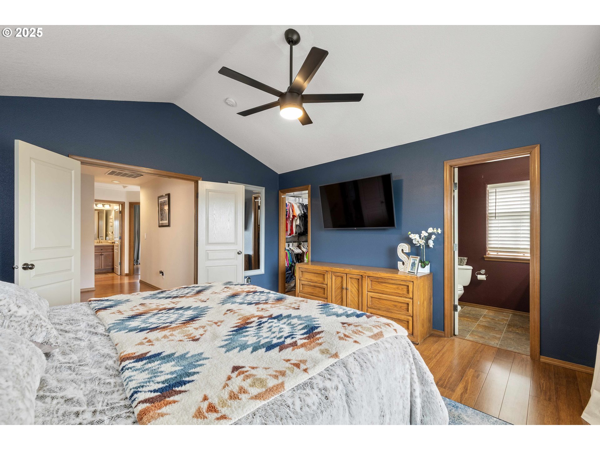 18465 Meadow Avenue Sandy, OR 97055 - Photo 21 of 43 a bedroom with a bed and a flat screen tv