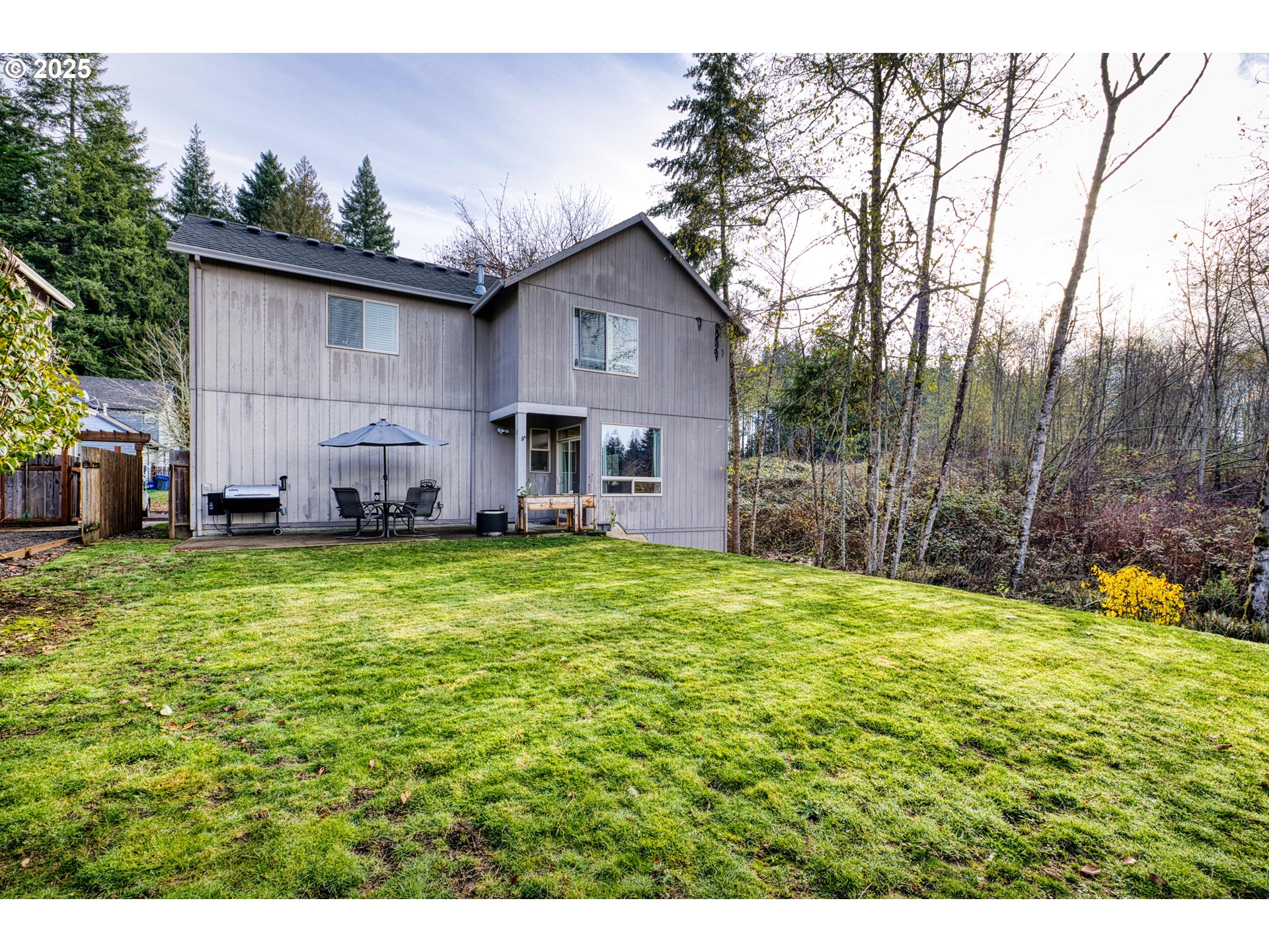 18465 Meadow Avenue Sandy, OR 97055 - Photo 37 of 43 a view of a backyard with a large tree