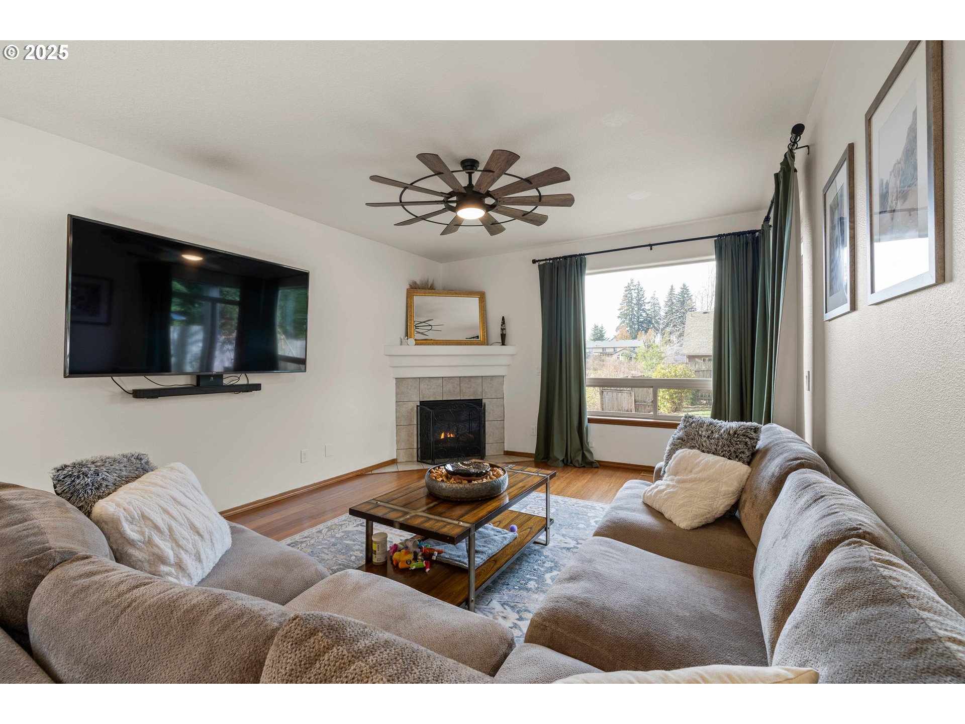 18465 Meadow Avenue Sandy, OR 97055 - Photo 6 of 43 a living room with furniture a flat screen tv and a fireplace