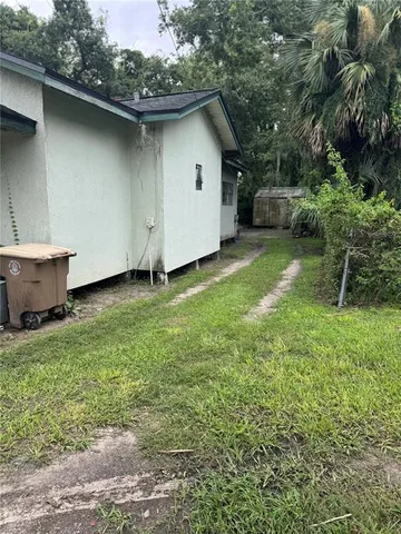 a backyard of a house with seating space
