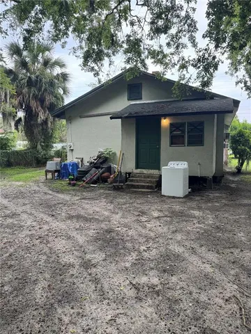 a front view of house with yard and seating area