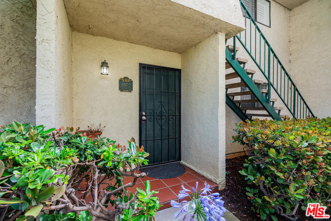 6475 Kanan Dume Road Malibu, CA 90265 - Photo 17 of 17 a house with flowers in front of it