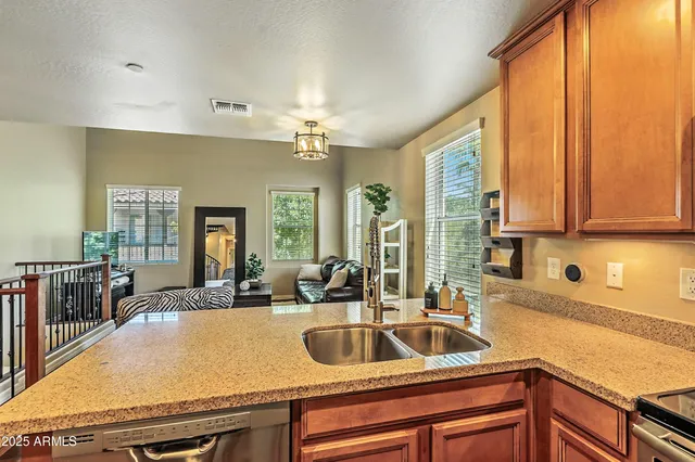 a kitchen with a sink and cabinets