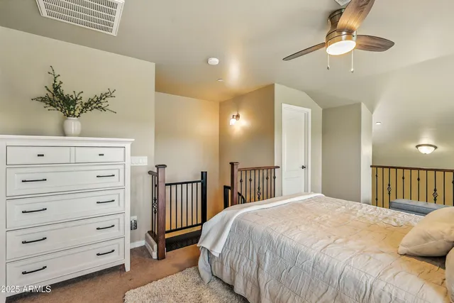 a bedroom with a bed and a dresser