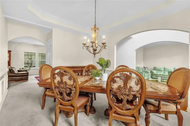 a bedroom with a bed and a potted plant