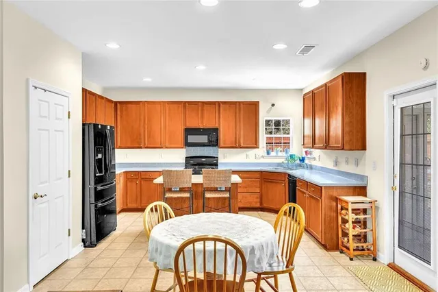 a kitchen with stainless steel appliances a sink counter space and a window