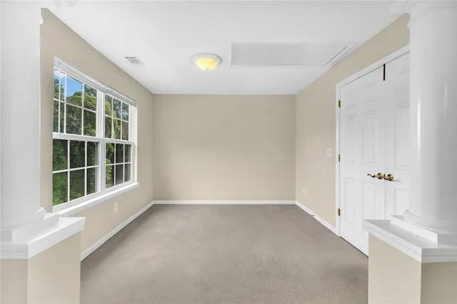 a spacious bathroom with a double vanity sink a mirror and a bathtub