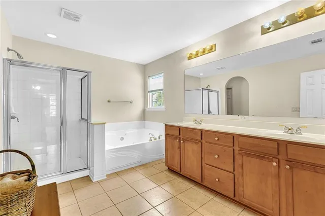 a view of an empty room with a ceiling fan