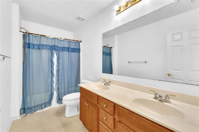 a view of a livingroom with furniture and a large window