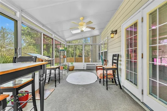 an aerial view of a house with a yard basket ball court and outdoor seating