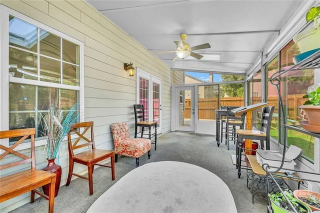 an aerial view of a chairs and swimming pool