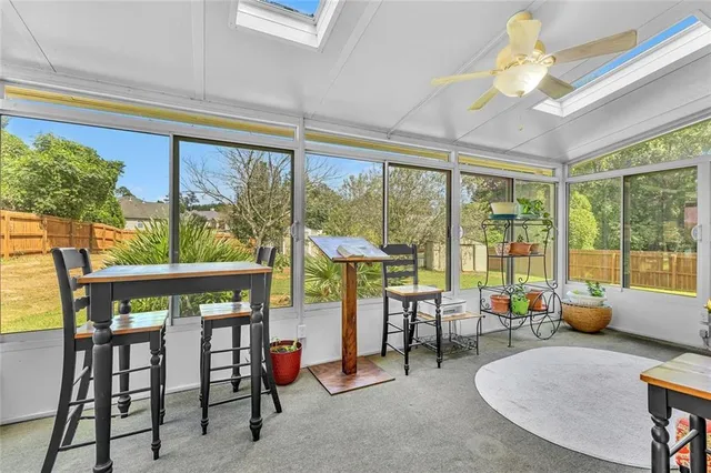 a swimming pool with some tall trees