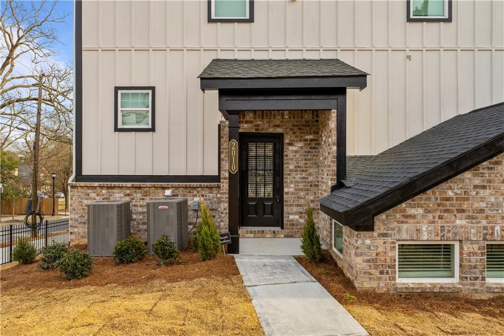 2010 Main Street Northwest Atlanta, GA 30318 - Photo 1 of 37 a front view of a house with garden