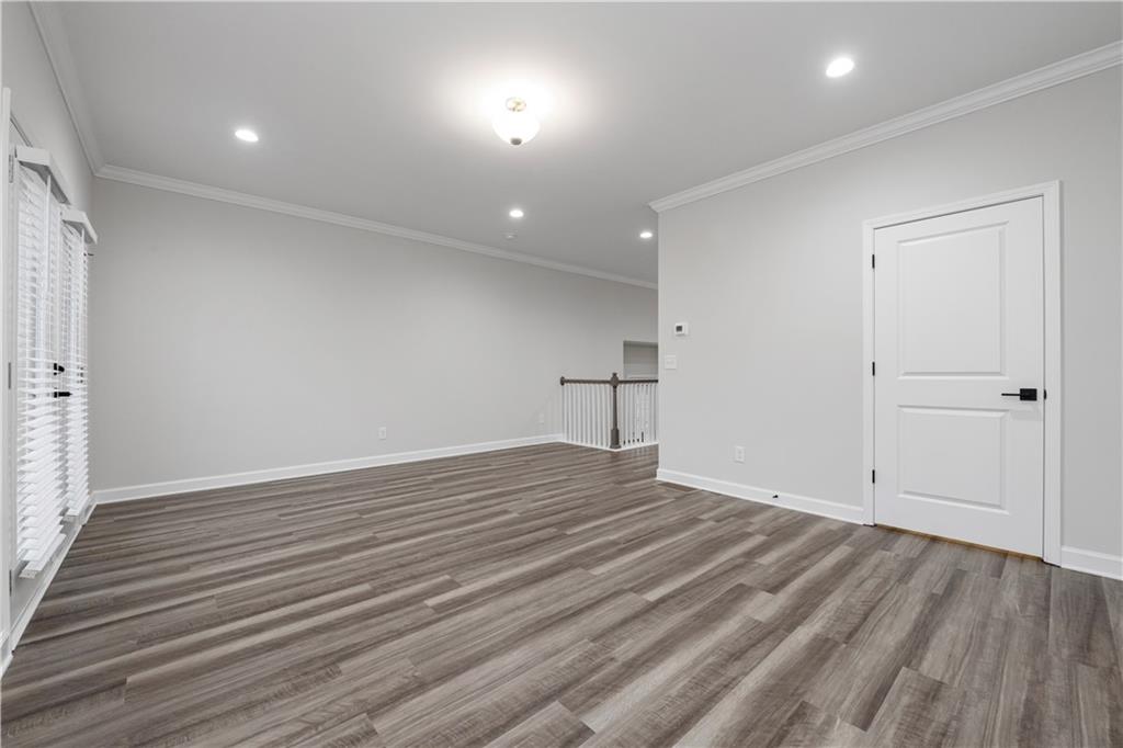 2010 Main Street Northwest Atlanta, GA 30318 - Photo 12 of 37 an empty room with wooden floor and windows