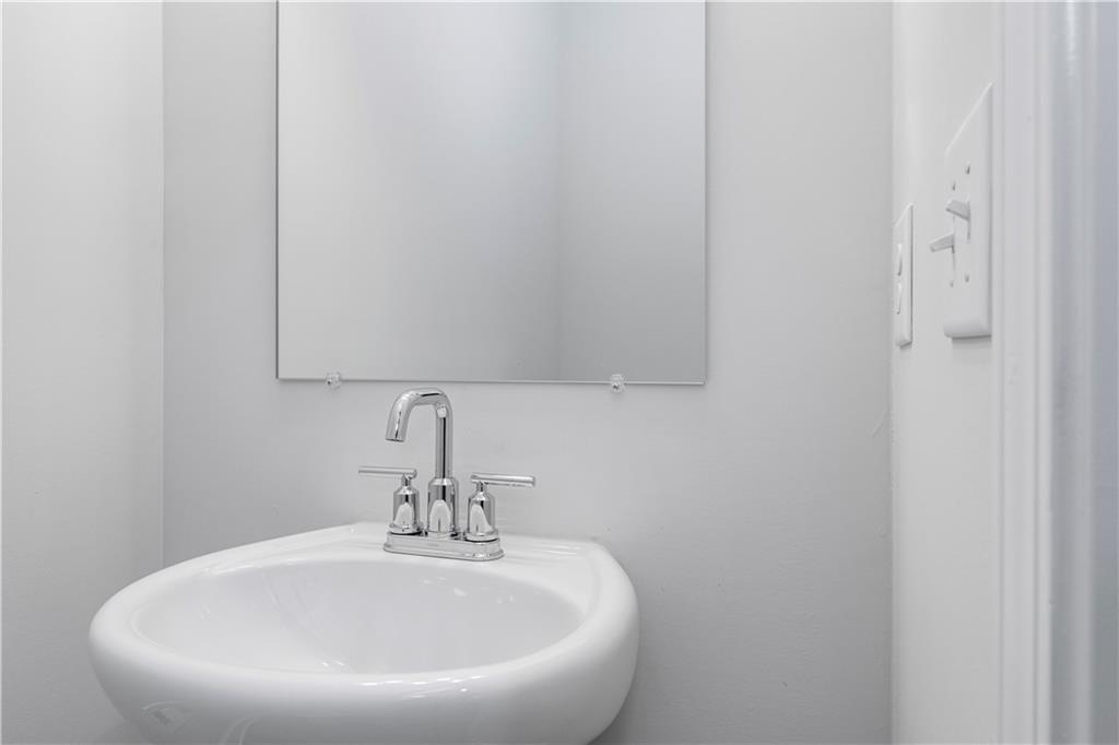 2010 Main Street Northwest Atlanta, GA 30318 - Photo 15 of 37 a bathroom with a sink and mirror