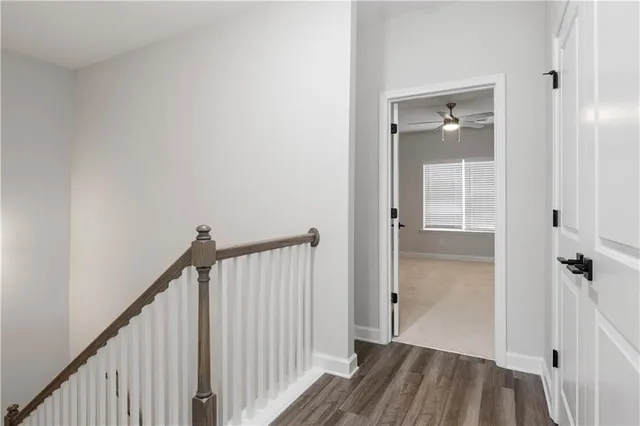 a view of a livingroom with a ceiling fan and window