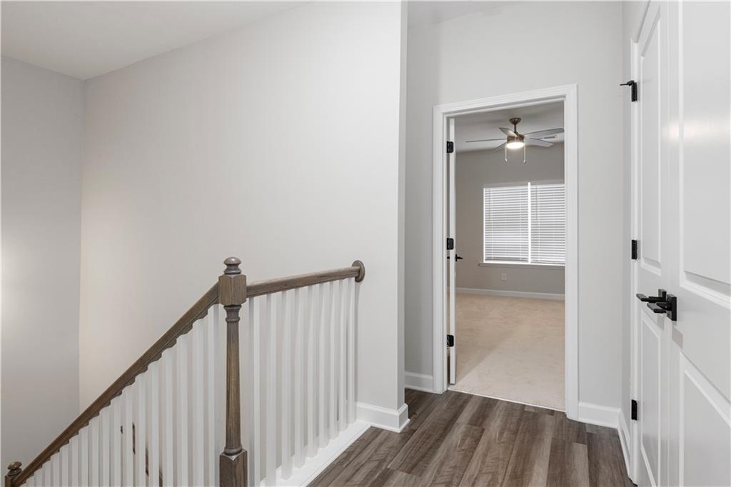 2010 Main Street Northwest Atlanta, GA 30318 - Photo 16 of 37 a view of a hallway with wooden floor and staircase
