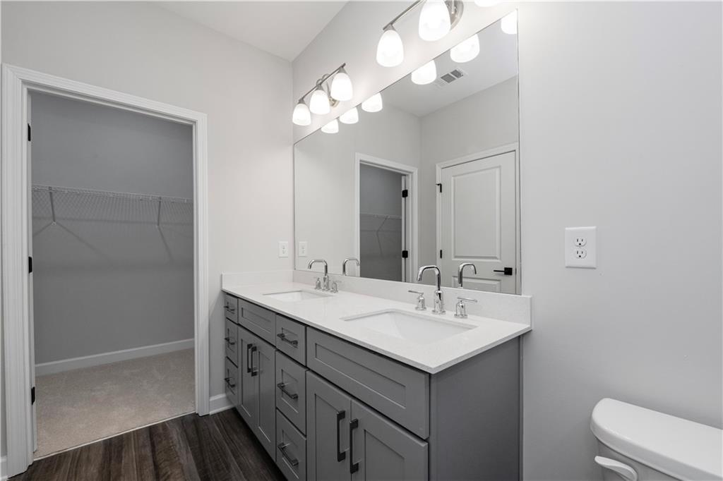 2010 Main Street Northwest Atlanta, GA 30318 - Photo 21 of 37 a bathroom with a sink a light fixture and a mirror