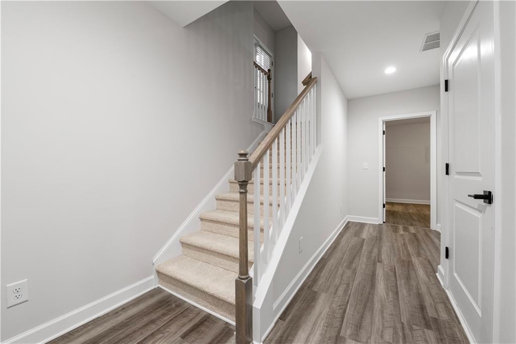 2010 Main Street Northwest Atlanta, GA 30318 - Photo 27 of 37 a view of a hallway with wooden floor and entryway
