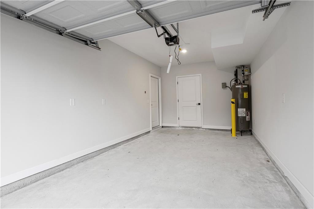 2010 Main Street Northwest Atlanta, GA 30318 - Photo 32 of 37 an empty room with staircase ceiling fan and windows