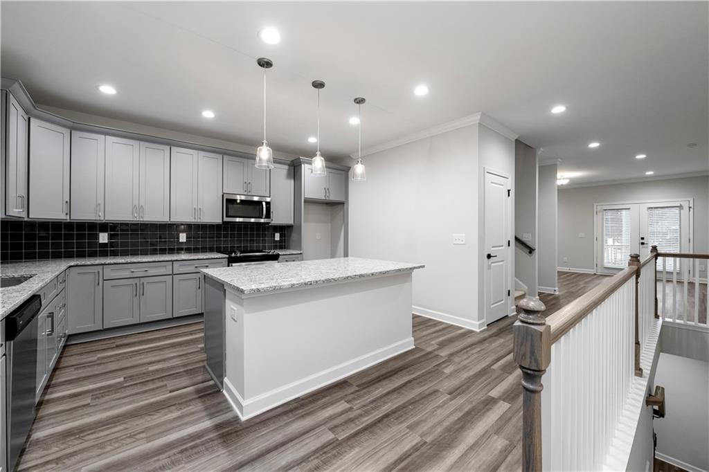 2010 Main Street Northwest Atlanta, GA 30318 - Photo 8 of 37 a view of kitchen with granite countertop stainless steel appliances sink stove microwave and cabinets